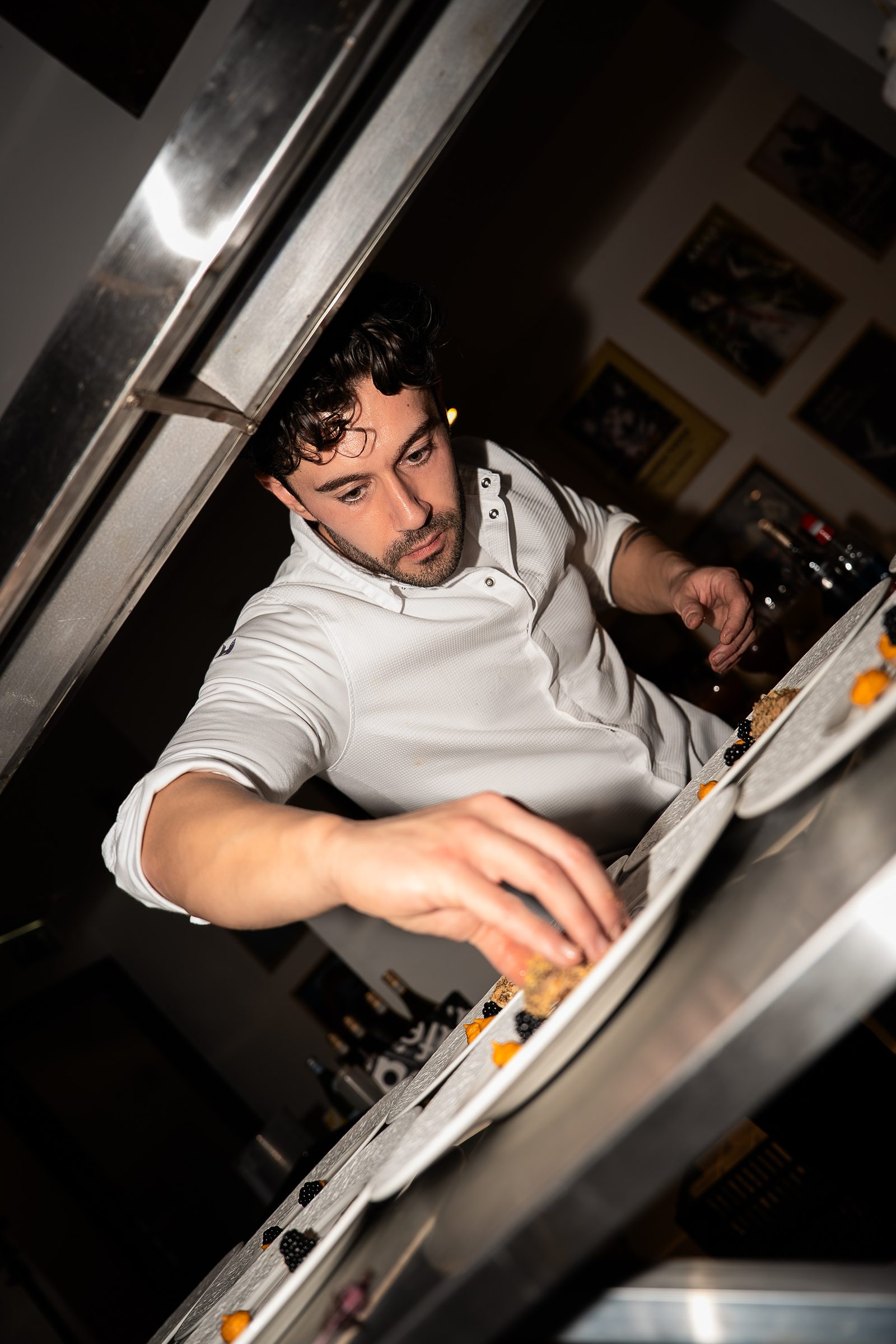 Michael Cervino finishing a dish by hand during the evening's service